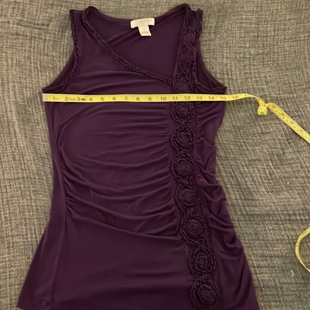 Stylish tank with asymmetric neckline and flower trim